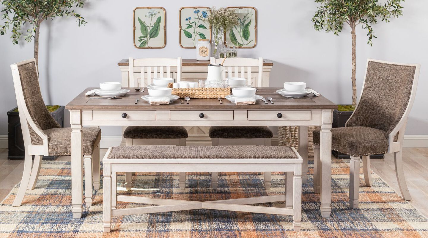 Dining room with brown and beige coffee table, bench, and matching chairs