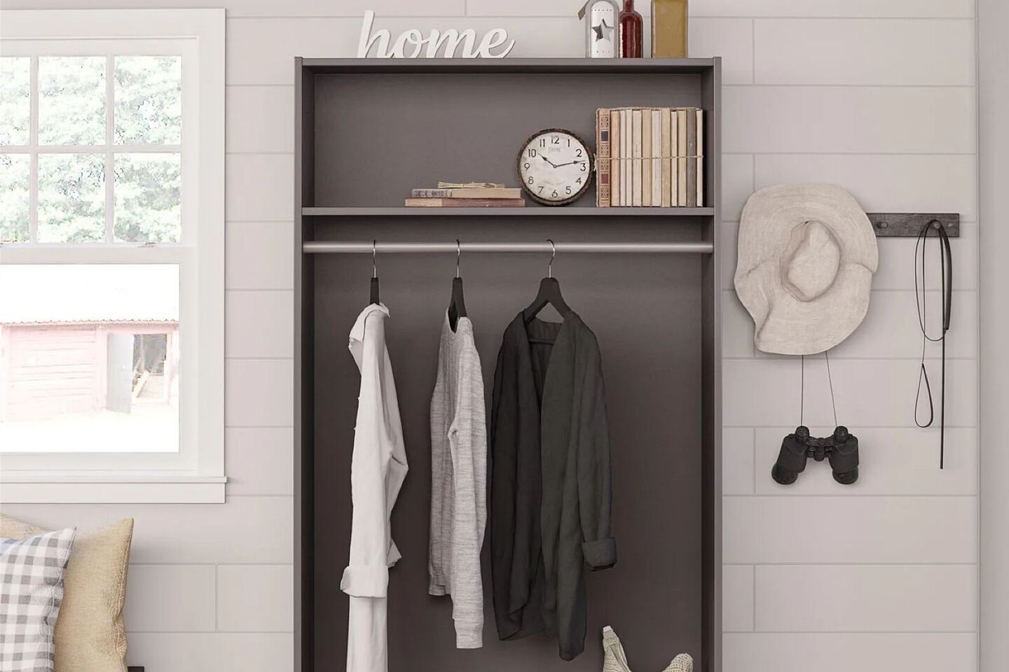 Entryway shelf with clothing, books, and books organized within it