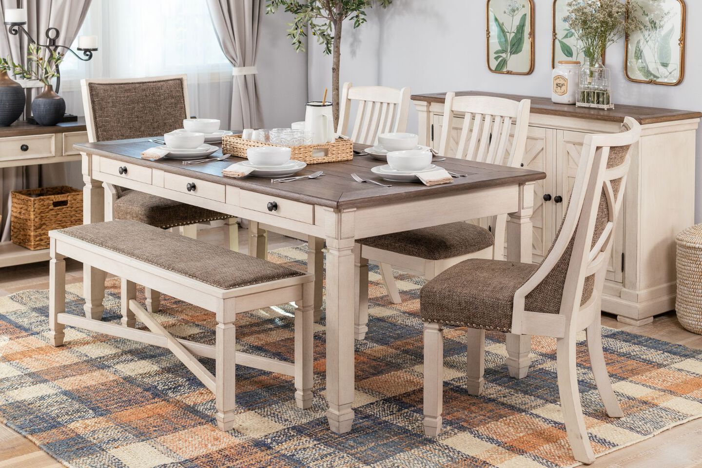 Dining room with brown and beige coffee table, bench, and matching chairs