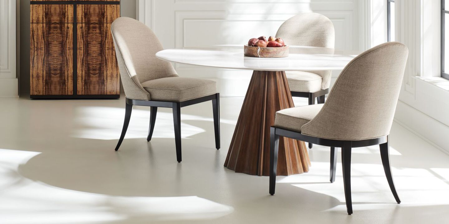 brown and white dining table surrounded by three beige and black chairs brown and white dining table surrounded by three beige and black chairs