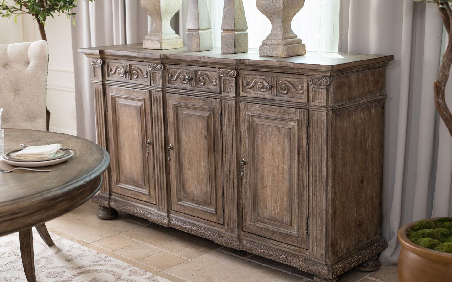 Light brown wooden cabinet next to a matching brown dining table