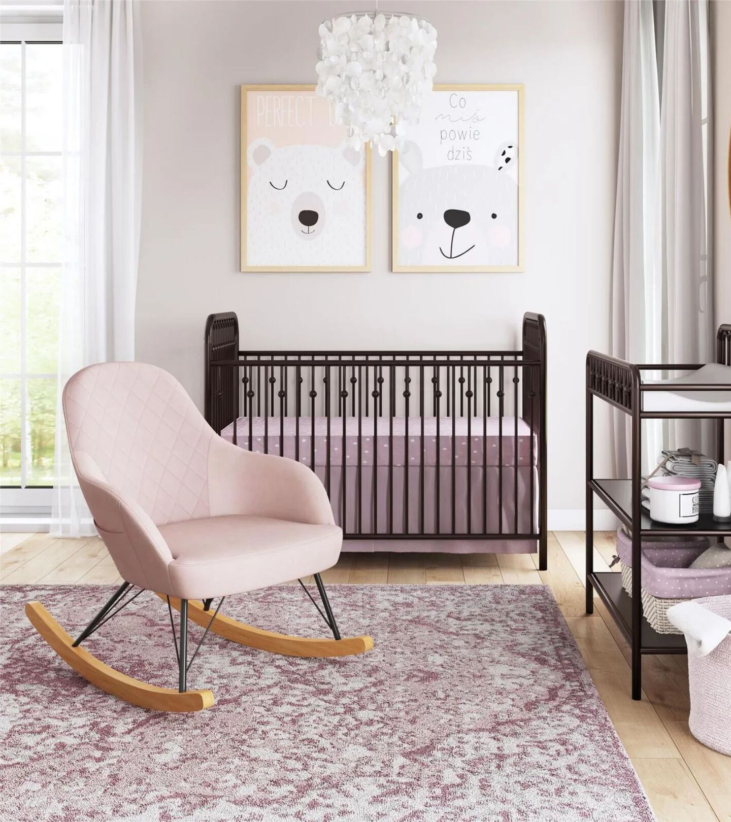 nursey with light pink rocking chair and dark brown crib