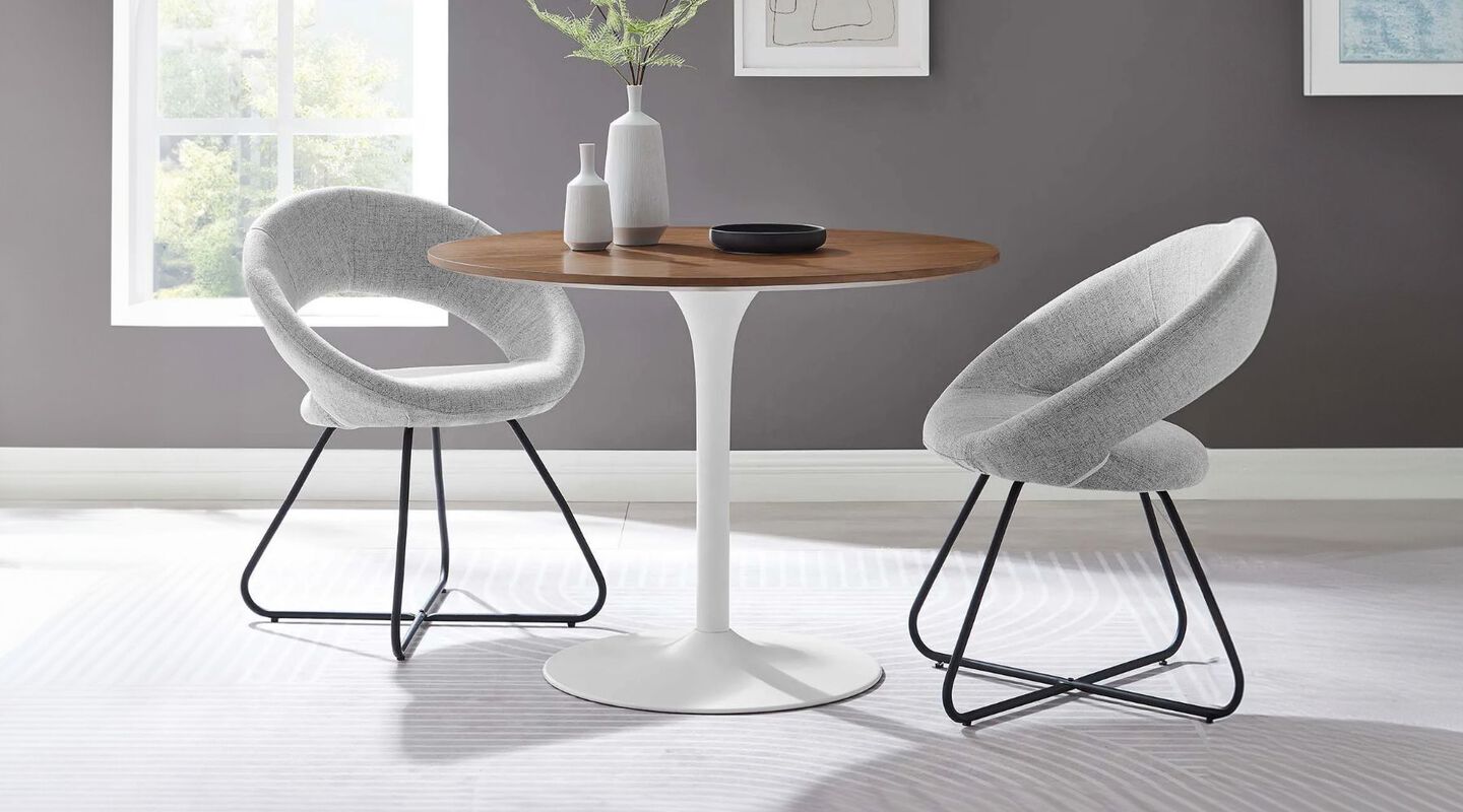 Dining room setting with brown and white coffee table and two light grey chairs