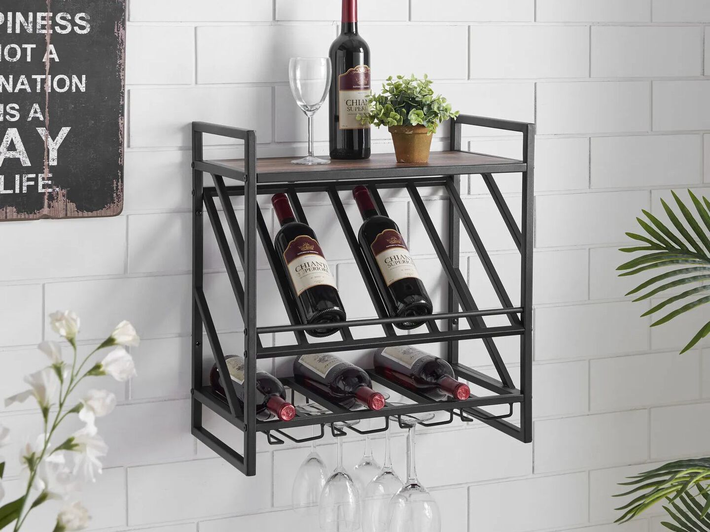 Floating wine rack filled with bottles of wine hanging on a white brick wall