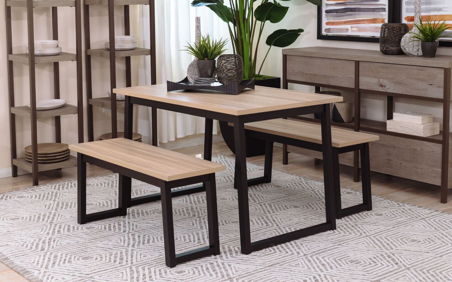 Black and light wooden kitchen table with fake plant and tray on top