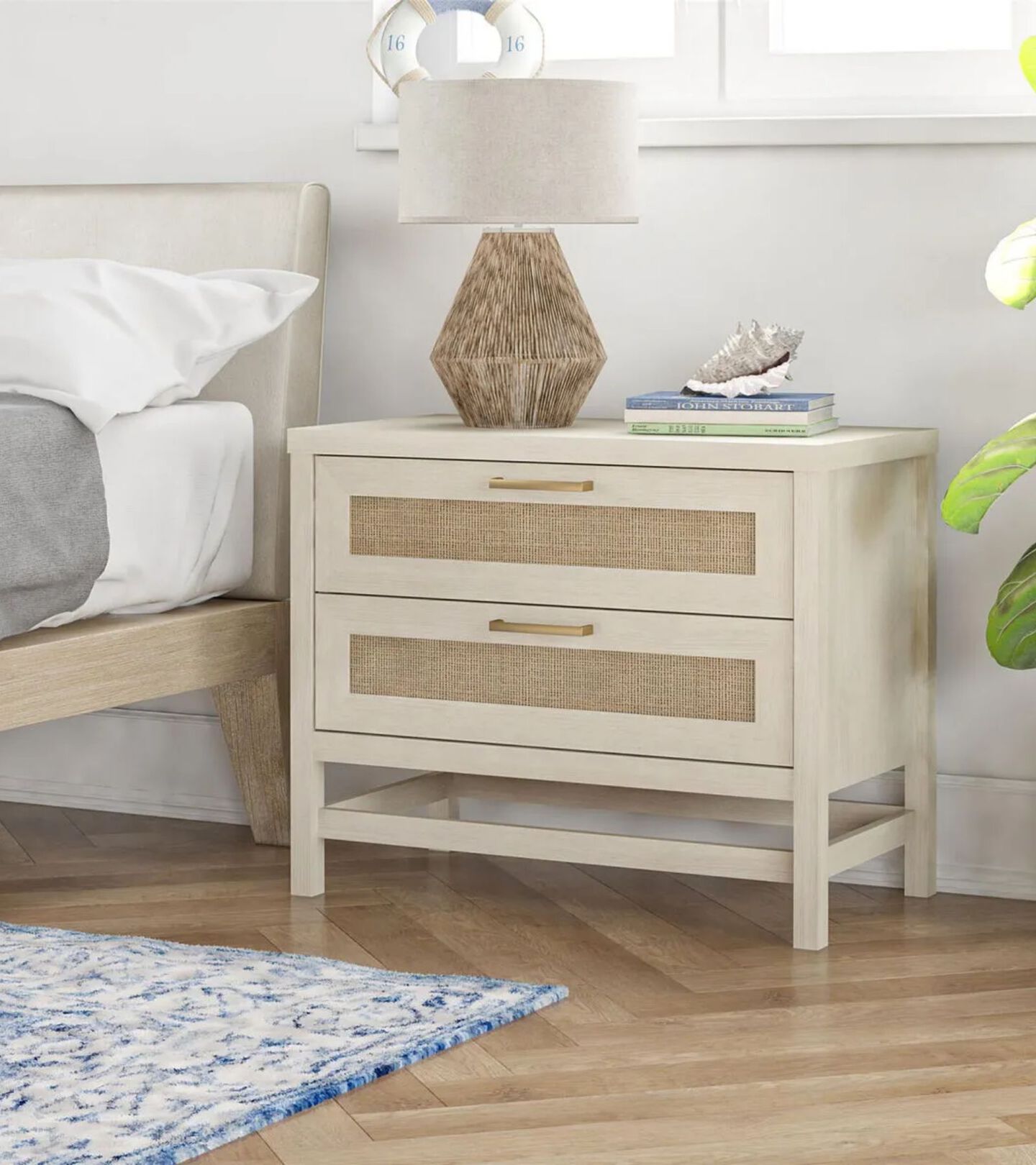 light beige and tan nightstand with brown and white lamp atop