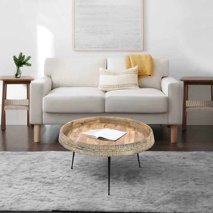 29 Inch Modern Handcrafted Round Coffee Table, Natural Brown Wood Top with Carved Edge, Black Iron Legs-Benzara