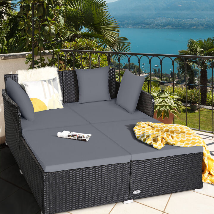 Spacious Outdoor Rattan Daybed with Upholstered Cushions and Pillows