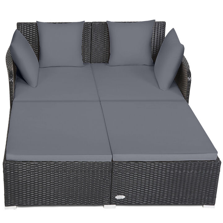 Spacious Outdoor Rattan Daybed with Upholstered Cushions and Pillows