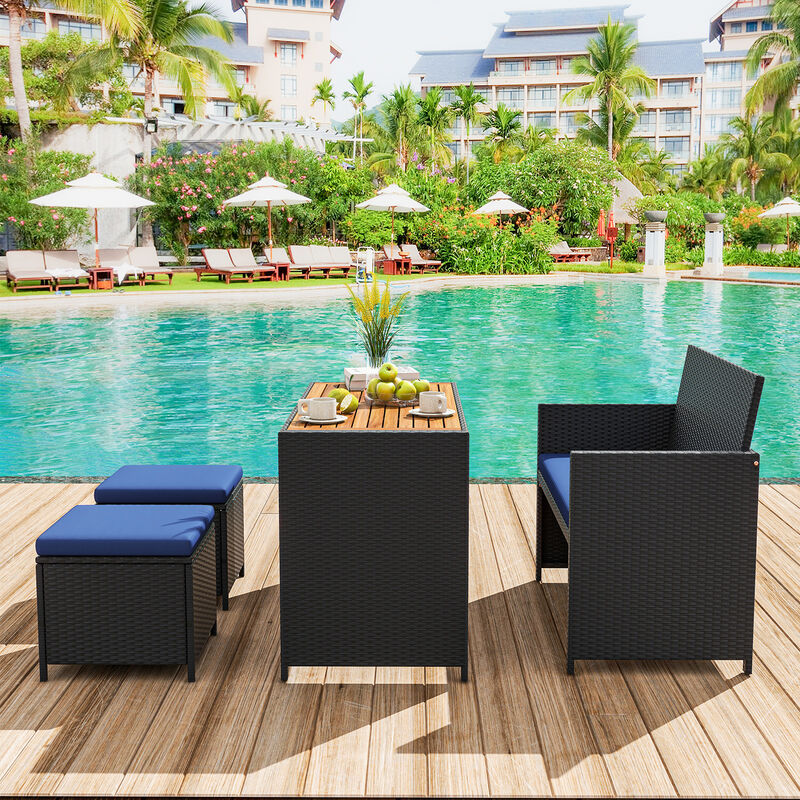 4 Piece Outdoor Dining Set with Wood Topped Dining Table  Rattan Loveseat Chair and 2 Ottomans