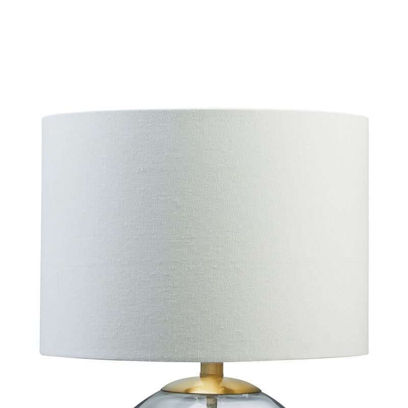 21 Inch Table Lamp, White Drum Shade, Round Clear Glass Base, Brass Metal - Benzara