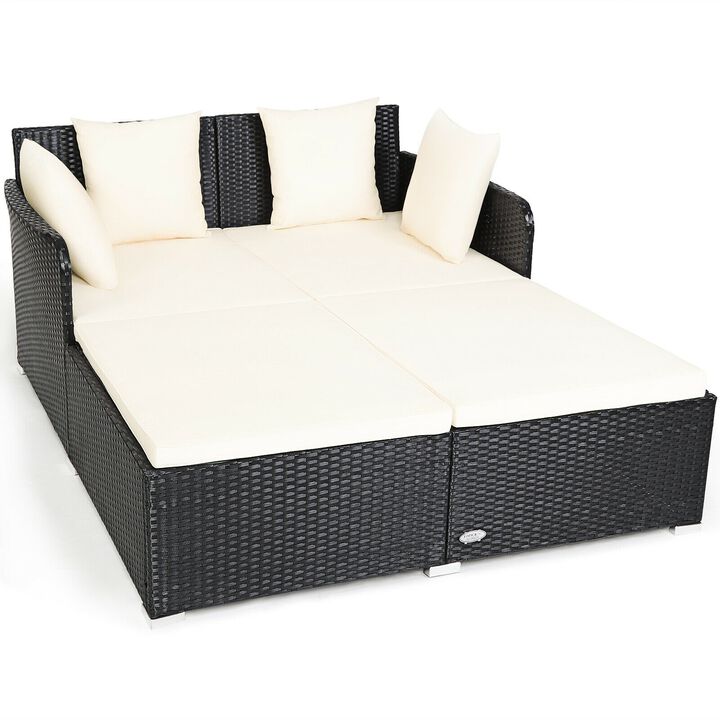Spacious Outdoor Rattan Daybed with Upholstered Cushions and Pillows