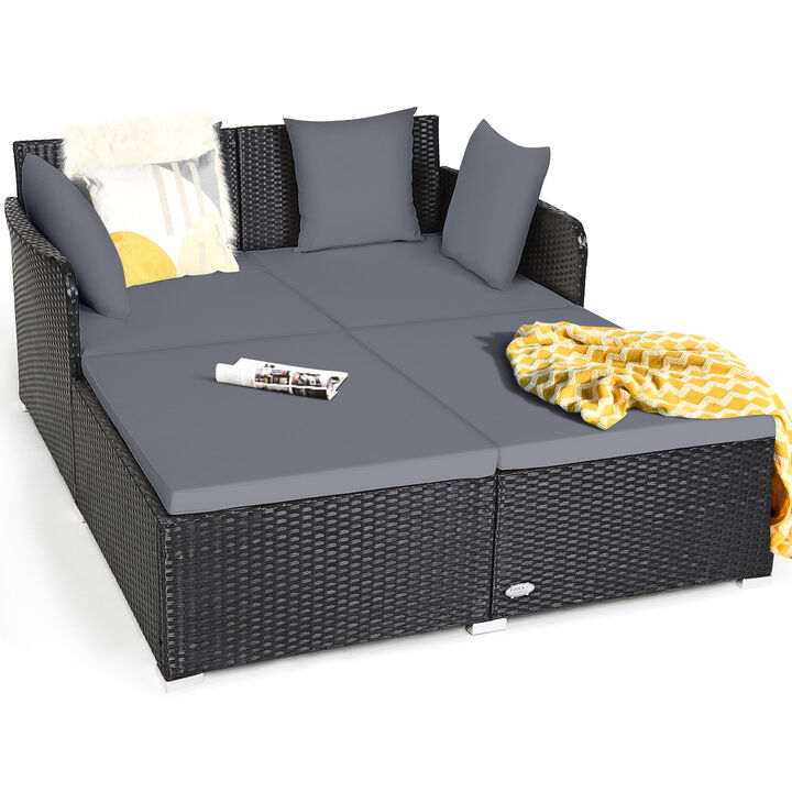 Spacious Outdoor Rattan Daybed with Upholstered Cushions and Pillows