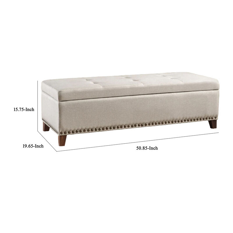 Nancy Storage Ottoman Bench, 51 Inch Beige Fabric, Brass Nailhead Trim - Benzara