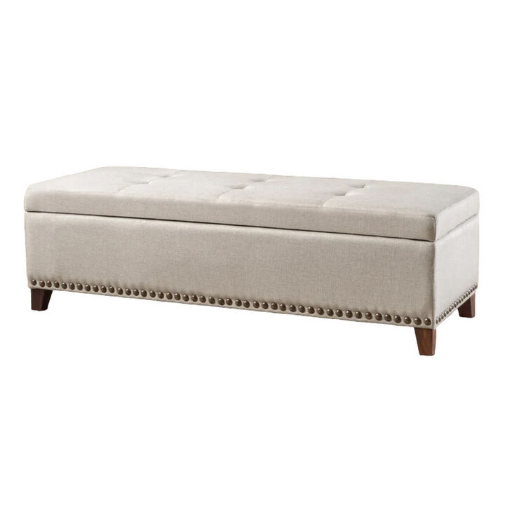 Nancy Storage Ottoman Bench, 51 Inch Beige Fabric, Brass Nailhead Trim - Benzara