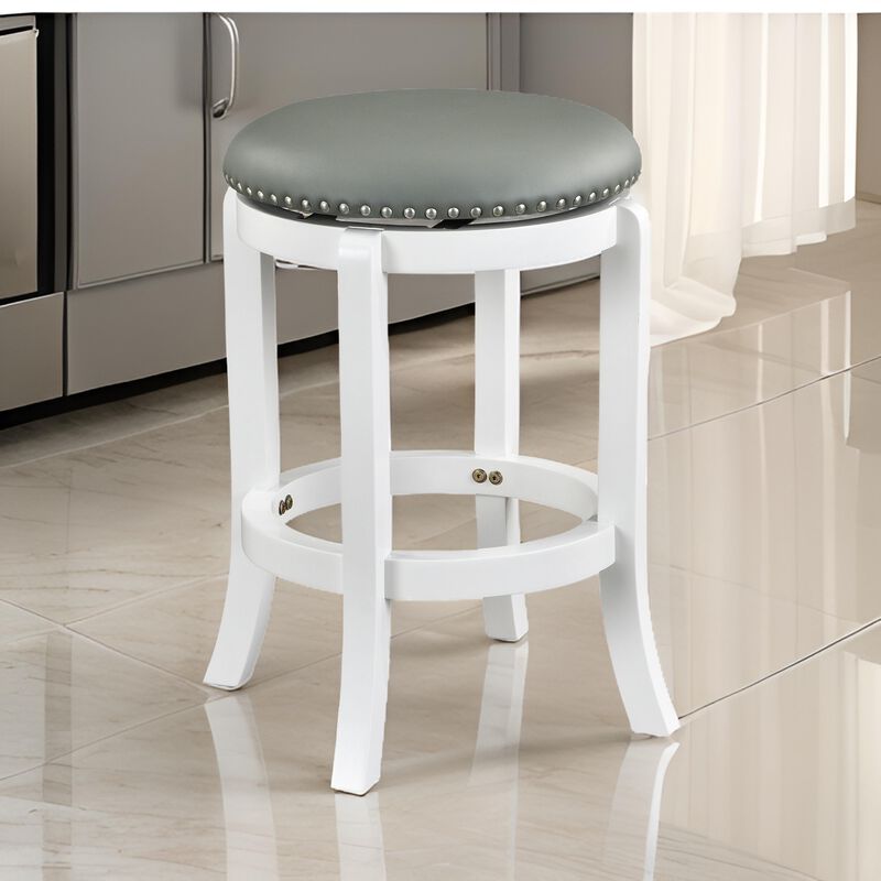 Ovi 25 Inch Backless Swivel Counter Stool, Gray Faux Leather, Nailhead Trim - Benzara