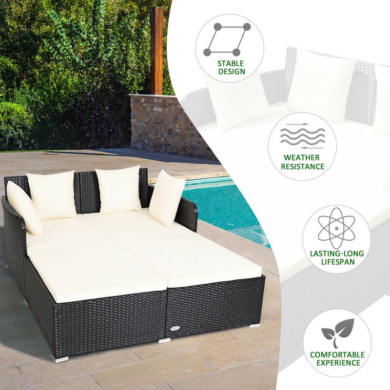 Spacious Outdoor Rattan Daybed with Upholstered Cushions and Pillows