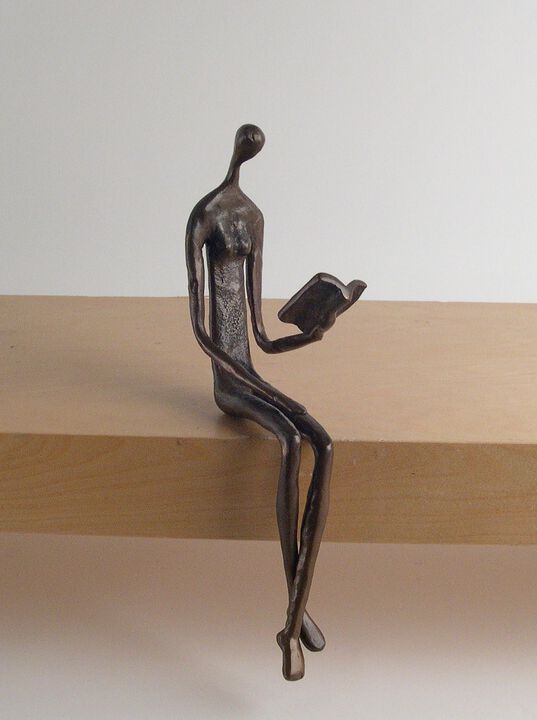 Woman Reading Over Ledge Cast Bronze
