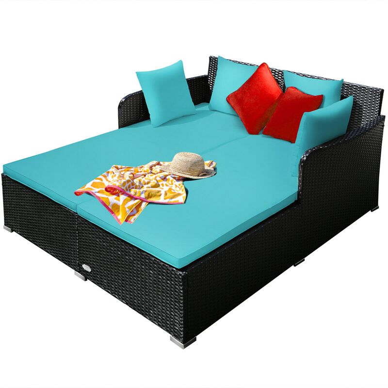 Spacious Outdoor Rattan Daybed with Upholstered Cushions and Pillows
