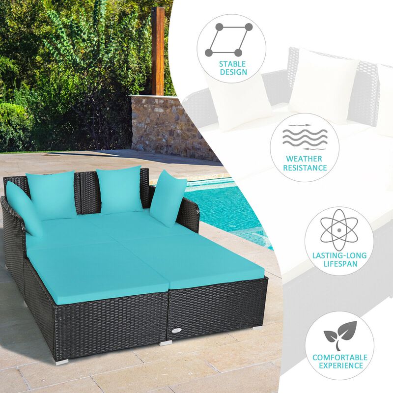 Spacious Outdoor Rattan Daybed with Upholstered Cushions and Pillows