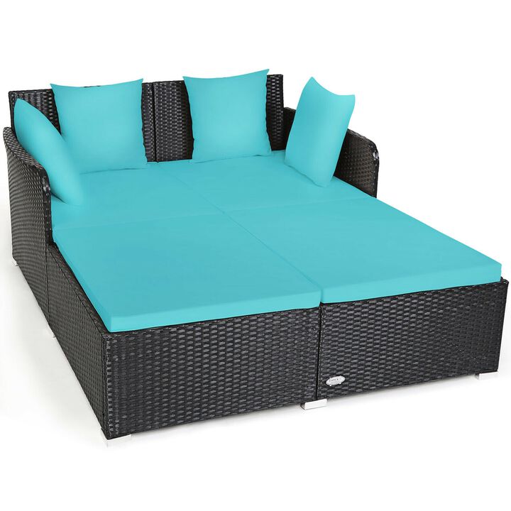 Spacious Outdoor Rattan Daybed with Upholstered Cushions and Pillows