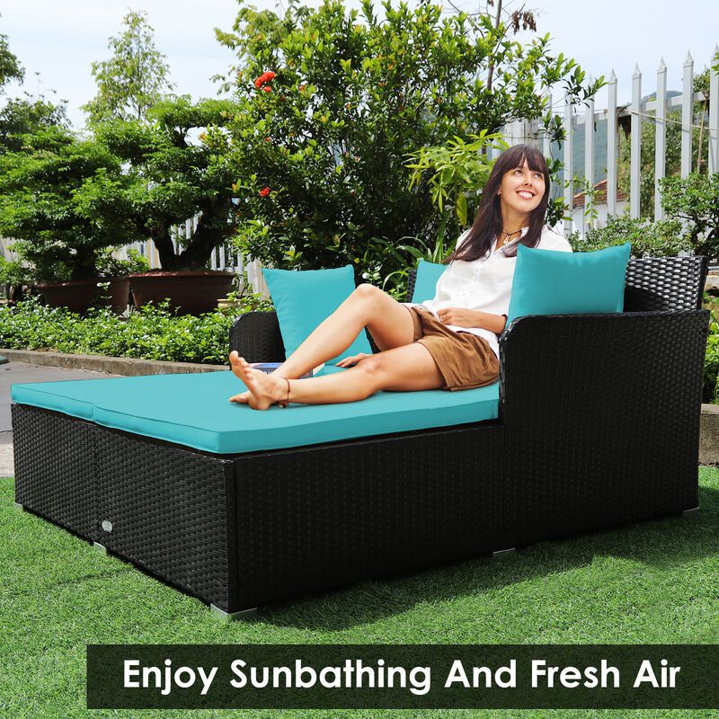Spacious Outdoor Rattan Daybed with Upholstered Cushions and Pillows
