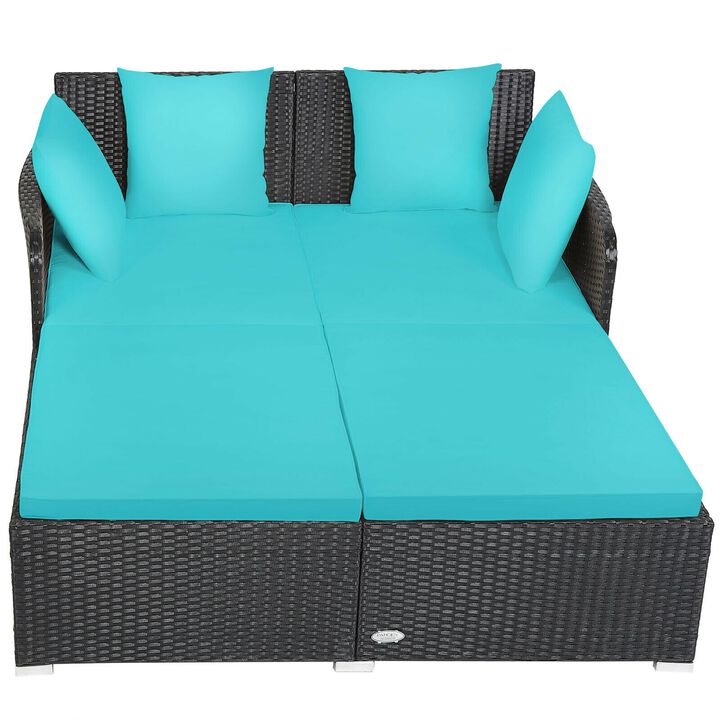 Spacious Outdoor Rattan Daybed with Upholstered Cushions and Pillows