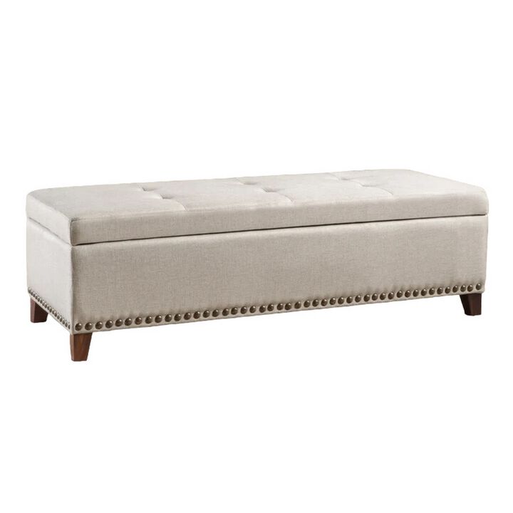 Nancy Storage Ottoman Bench, 51 Inch Beige Fabric, Brass Nailhead Trim - Benzara