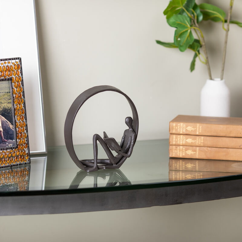 Encircled Reader Iron Sculpture