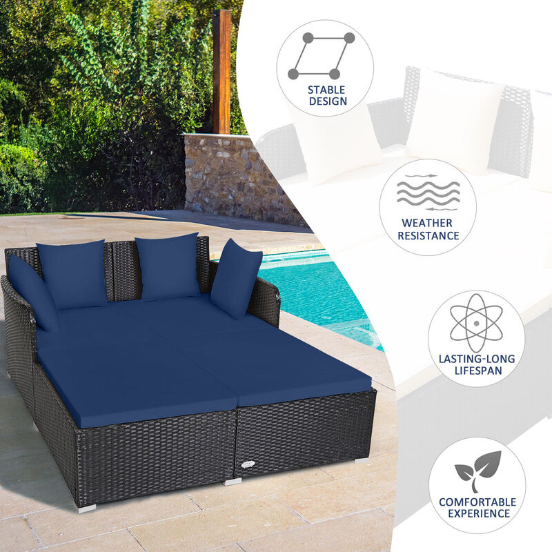 Spacious Outdoor Rattan Daybed with Upholstered Cushions and Pillows