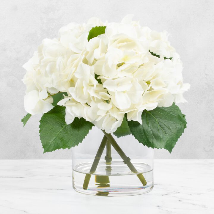 White hydrangeas centerpiece arrangement in vase