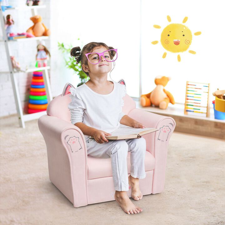 Pink kids chair with a cat face printed on backrest.