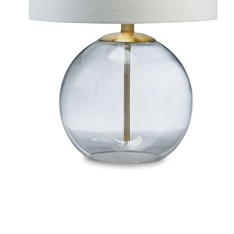 21 Inch Table Lamp, White Drum Shade, Round Clear Glass Base, Brass Metal - Benzara